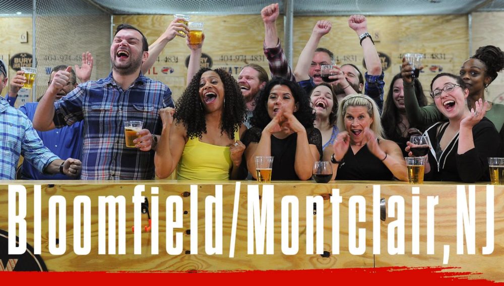 Bury The Hatchet Bloomfield Montclair NJ City Page Header Image. Axe throwers celebrating with hands in air