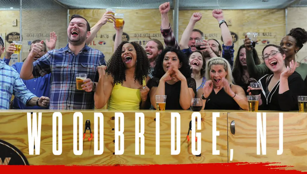 Bury The Hatchet Woodbridge NJ City Page Header Image. Axe throwers celebrating with hands in air